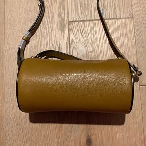 Tan barrel shape Rebecca minkoff crossbody bag